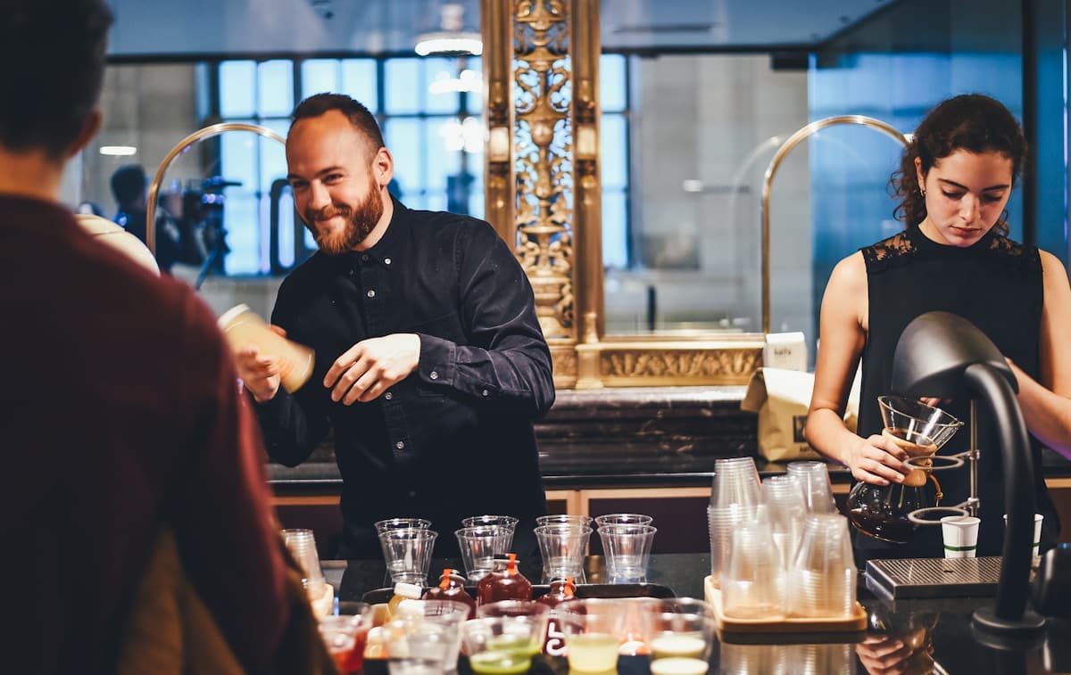 Bar staff working together during service